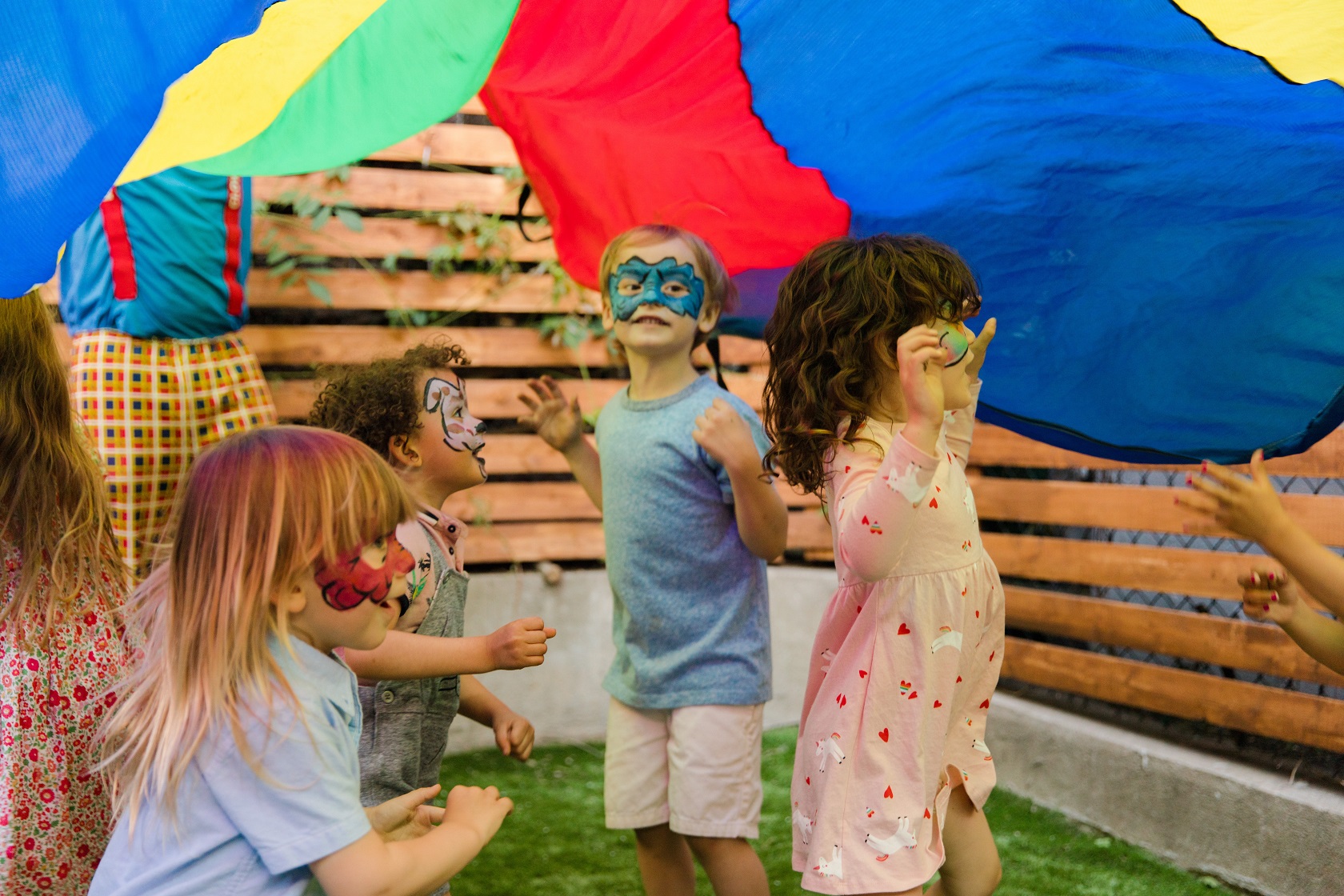 Kids wearing face paint at a party